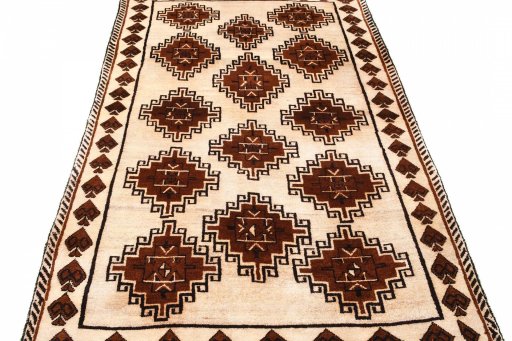 Surface texture of 2000s Persian Gabbeh rug with natural Wool and intricate pattern