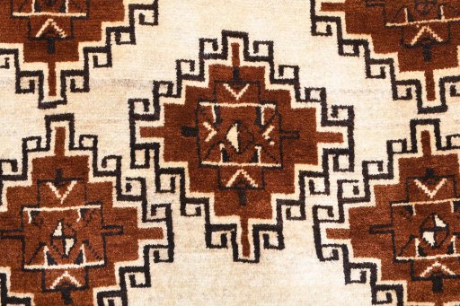 Backside of handmade 2000s Persian Gabbeh rug showing knot structure and weave density