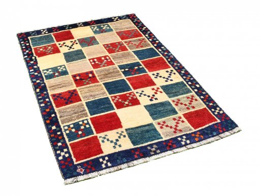 Corner detail of 2000s Persian Gabbeh rug showing border pattern and Wool pile