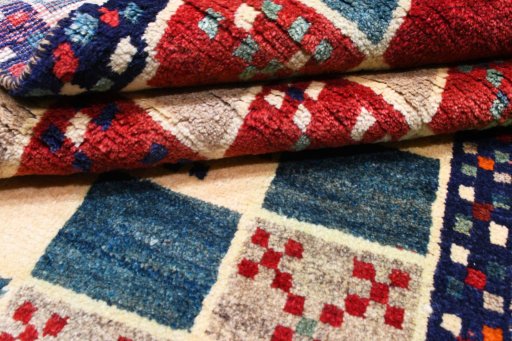 Full view of 2000s Persian Gabbeh rug from Iran / Persia, 145 × 96 cm in Multi Color tones