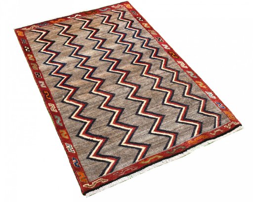 Corner detail of 2000s Persian Gabbeh rug showing border pattern and Wool pile