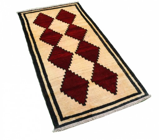 Corner detail of 2000s Persian Gabbeh rug showing border pattern and Wool pile