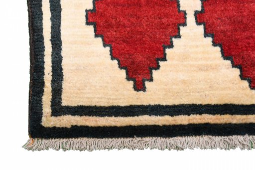 Full view of 2000s Persian Gabbeh rug from Iran / Persia, 190 × 95 cm in Beige tones