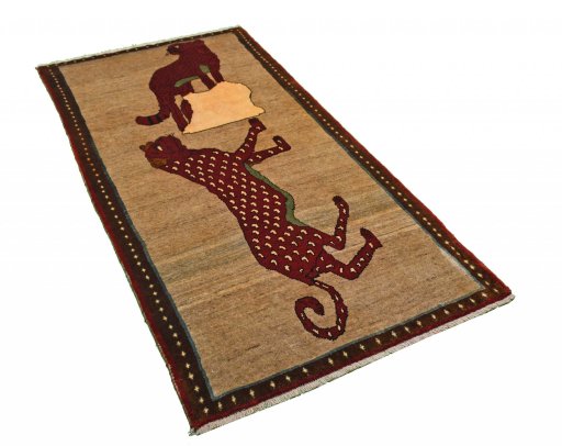Corner detail of 2000s Persian Gabbeh rug showing border pattern and Wool pile