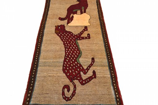 Surface texture of 2000s Persian Gabbeh rug with natural Wool and intricate pattern