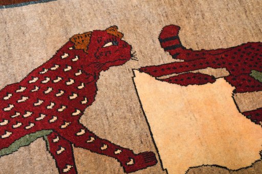 Backside of handmade 2000s Persian Gabbeh rug showing knot structure and weave density