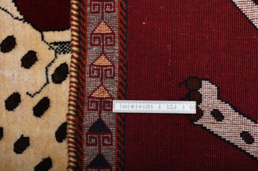 Backside of handmade 2000s Persian Gabbeh rug showing knot structure and weave density