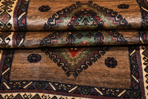 Corner detail of 2000s Persian Gabbeh rug showing border pattern and Wool pile