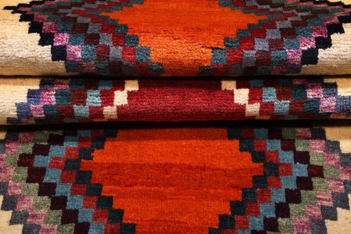 Corner detail of 2000s Persian Gabbeh rug showing border pattern and Wool pile
