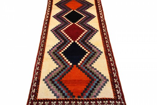 Surface texture of 2000s Persian Gabbeh rug with natural Wool and intricate pattern