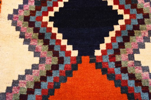 Backside of handmade 2000s Persian Gabbeh rug showing knot structure and weave density