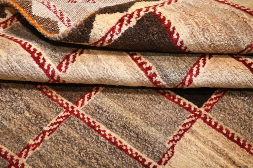 Corner detail of 2000s Persian Gabbeh rug showing border pattern and Wool pile