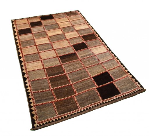 Corner detail of 2000s Persian Gabbeh rug showing border pattern and Wool pile