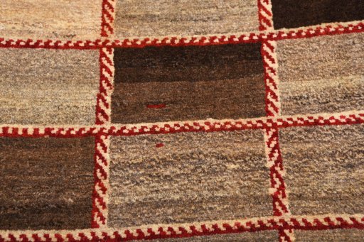 Backside of handmade 2000s Persian Gabbeh rug showing knot structure and weave density