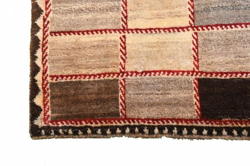 Full view of 2000s Persian Gabbeh rug from Iran / Persia, 195 × 120 cm in Beige tones