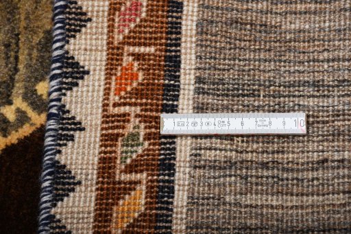 Surface texture of 2000s Persian Gabbeh rug with natural Wool and intricate pattern