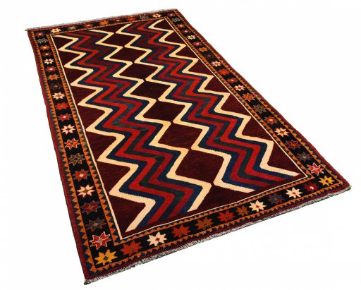 Corner detail of 2000s Persian Gabbeh rug showing border pattern and Wool pile