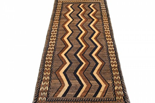 Surface texture of 2000s Persian Gabbeh rug with natural Wool and intricate pattern