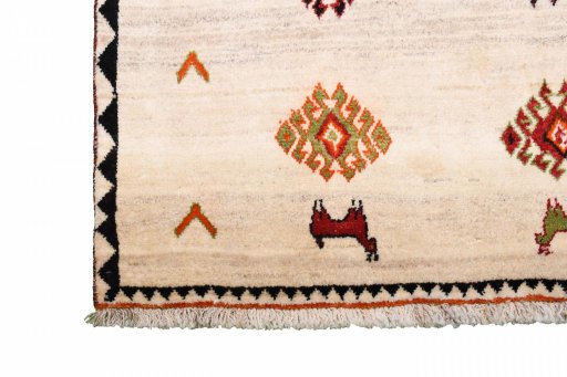 Corner detail of 2000s Persian Gabbeh rug showing border pattern and Wool pile