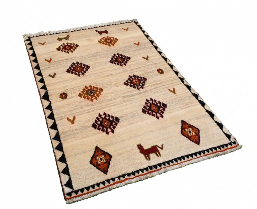Corner detail of 2000s Persian Gabbeh rug showing border pattern and Wool pile