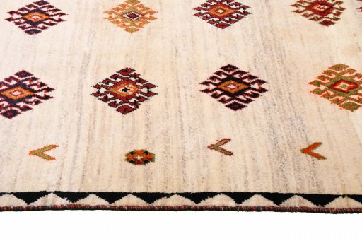 Full view of 2000s Persian Gabbeh rug from Iran / Persia, 175 × 115 cm in Beige tones