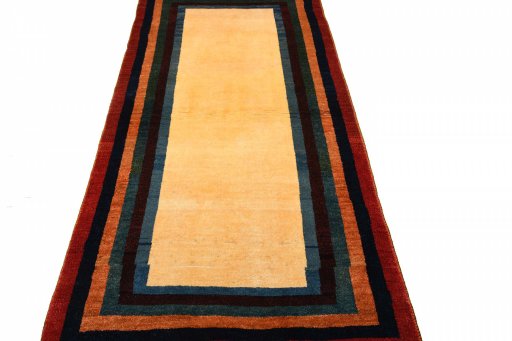 Surface texture of 2000s Persian Gabbeh rug with natural Wool and intricate pattern