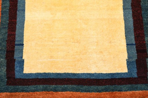 Backside of handmade 2000s Persian Gabbeh rug showing knot structure and weave density