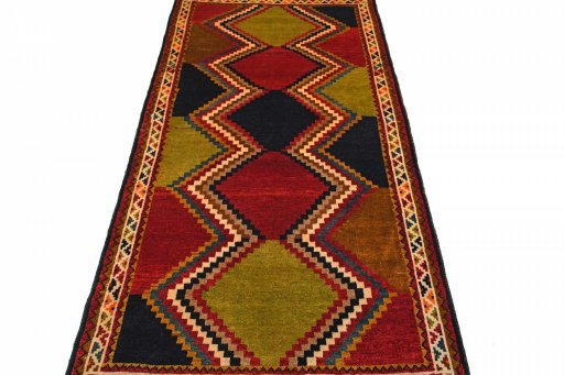 Surface texture of 2000s Persian Gabbeh rug with natural Wool and intricate pattern