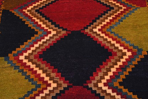 Central medallion detail of 2000s Persian Gabbeh rug from Iran / Persia