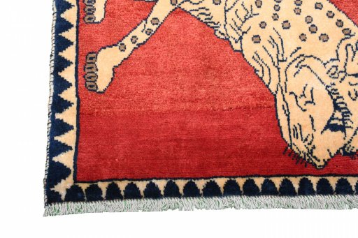 Corner detail of 2000s Persian Gabbeh rug showing border pattern and Wool pile