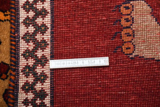 Surface texture of 2000s Persian Gabbeh rug with natural Wool and intricate pattern