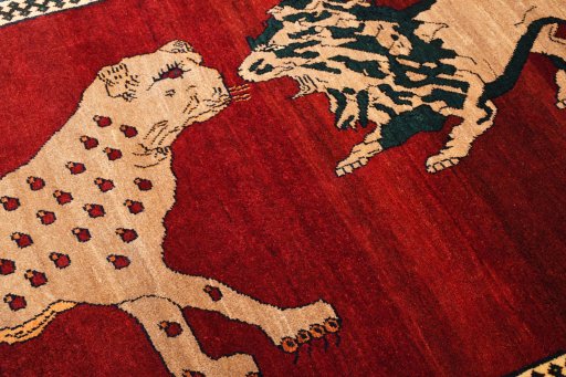 Backside of handmade 2000s Persian Gabbeh rug showing knot structure and weave density