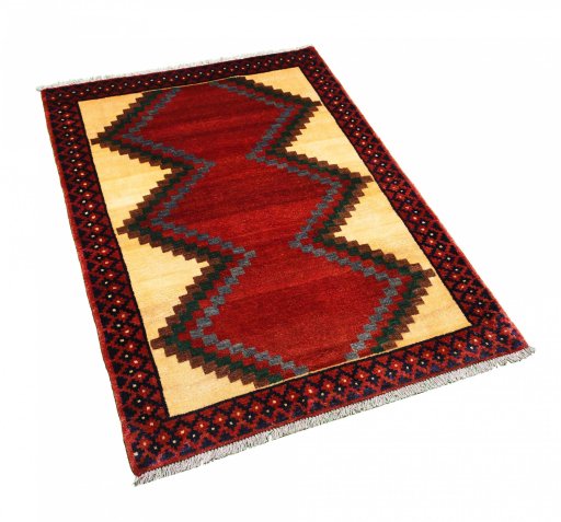 Corner detail of 2000s Persian Gabbeh rug showing border pattern and Wool pile