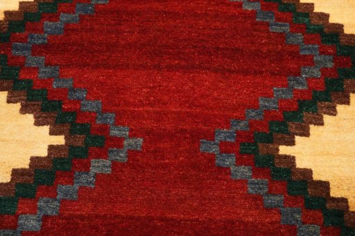 Backside of handmade 2000s Persian Gabbeh rug showing knot structure and weave density