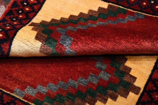 Full view of 2000s Persian Gabbeh rug from Iran / Persia, 150 × 107 cm in Red tones