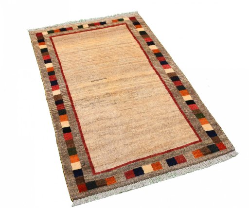 Corner detail of 2000s Persian Gabbeh rug showing border pattern and Wool pile