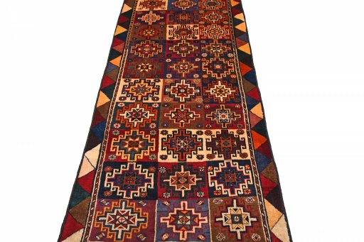 Surface texture of 2000s Persian Gabbeh rug with natural Wool and intricate pattern