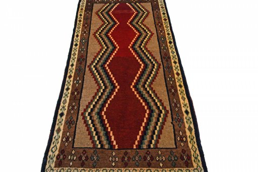 Surface texture of 2000s Persian Gabbeh rug with natural Wool and intricate pattern