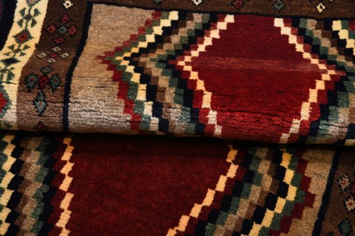 Full view of 2000s Persian Gabbeh rug from Iran / Persia, 173 × 85 cm in Red tones