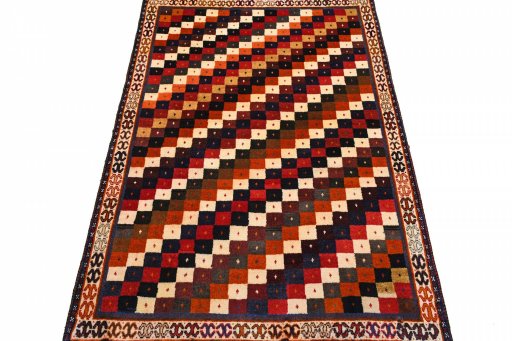 Surface texture of 2000s Persian Gabbeh rug with natural Wool and intricate pattern