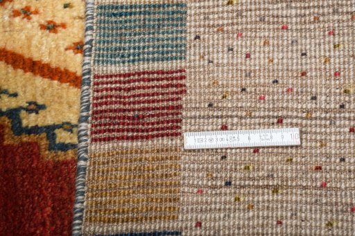 Surface texture of 2000s Persian Gabbeh rug with natural Wool and intricate pattern