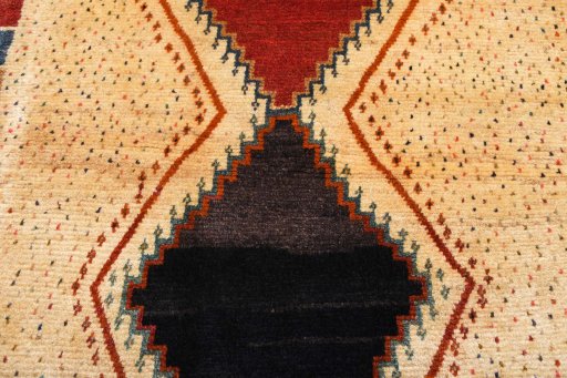 Backside of handmade 2000s Persian Gabbeh rug showing knot structure and weave density