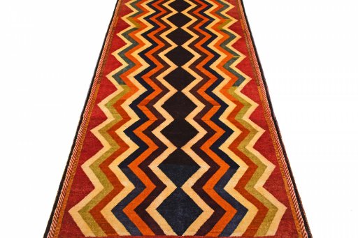 Surface texture of 2000s Persian Gabbeh rug with natural Wool and intricate pattern
