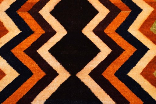 Backside of handmade 2000s Persian Gabbeh rug showing knot structure and weave density