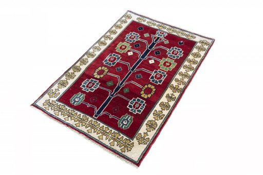 Corner detail of 2000s Persian Gabbeh rug showing border pattern and Wool pile