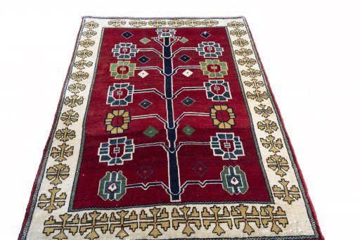 Surface texture of 2000s Persian Gabbeh rug with natural Wool and intricate pattern