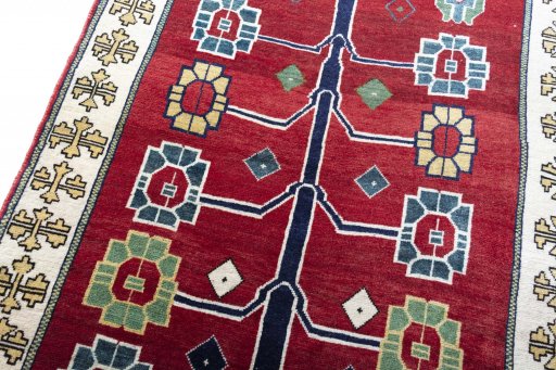 Backside of handmade 2000s Persian Gabbeh rug showing knot structure and weave density
