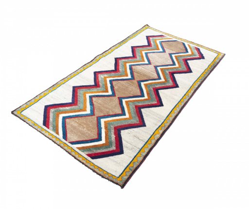 Corner detail of 2000s Persian Gabbeh rug showing border pattern and Wool pile