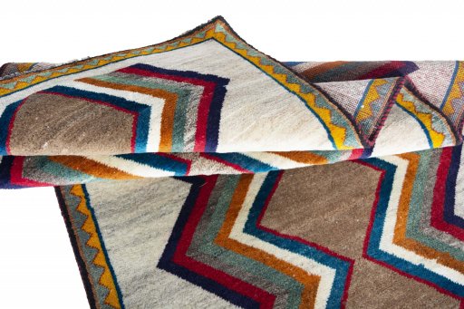 Full view of 2000s Persian Gabbeh rug from Iran / Persia, 187 × 100 cm in Beige tones