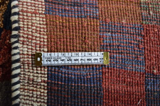 Close-up detail of 2000s Persian Gabbeh rug from Iran / Persia showing Wool weave